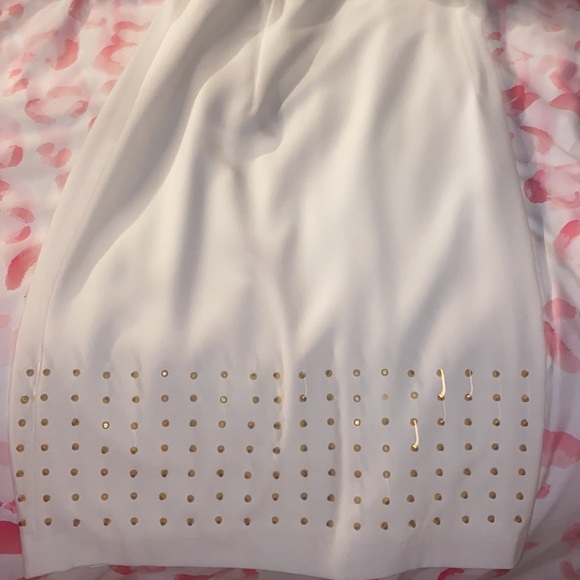 White Calvin klein dress with gold studs on bottom. - Picture 2 of 2